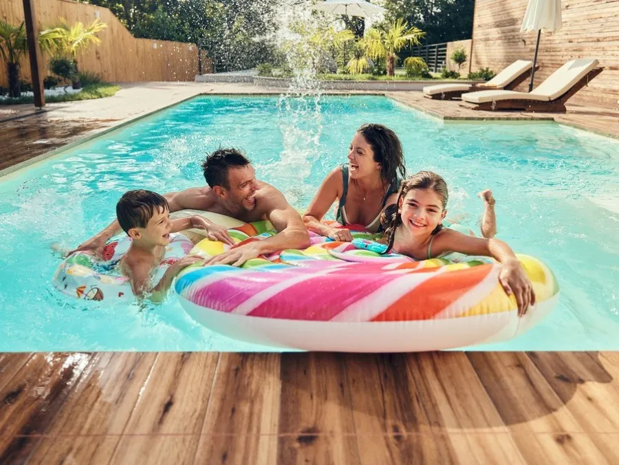 Family of four in a pool