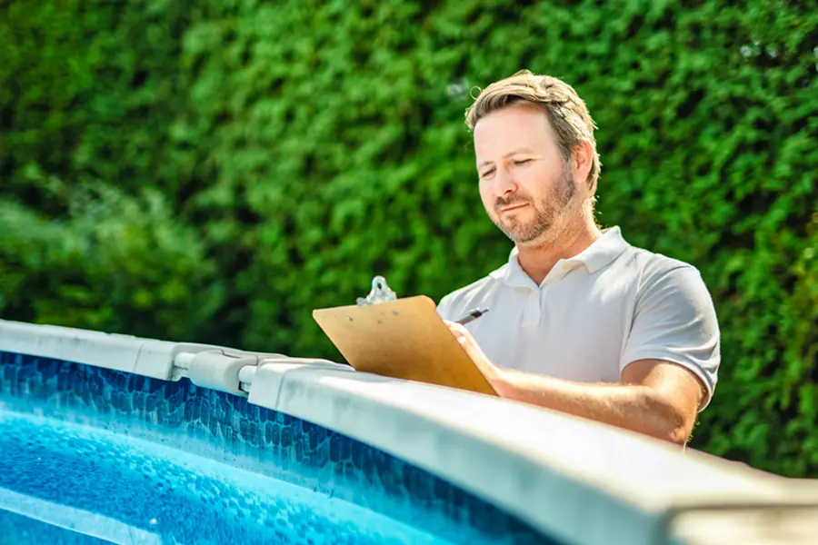 Freestyle Pools representative inspecting pool